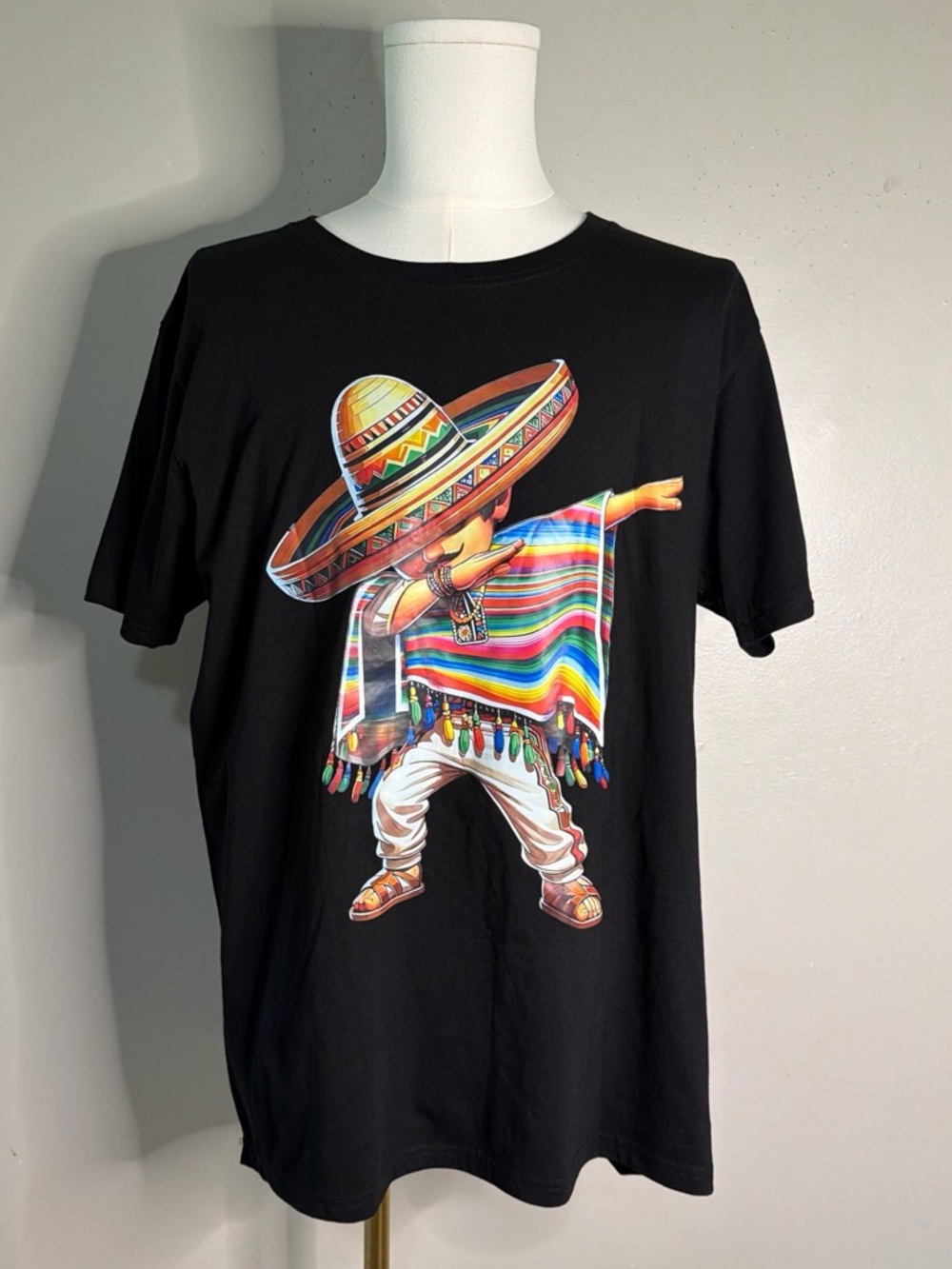 Black Graphic Tee with Colorful Dabbing Sombrero Figure